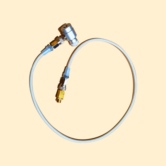 A white adapter kit for a rapid infusion machine with metallic connectors and a flexible tube.
