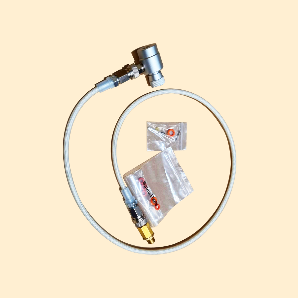 Medical device with tubing and connectors on a beige background